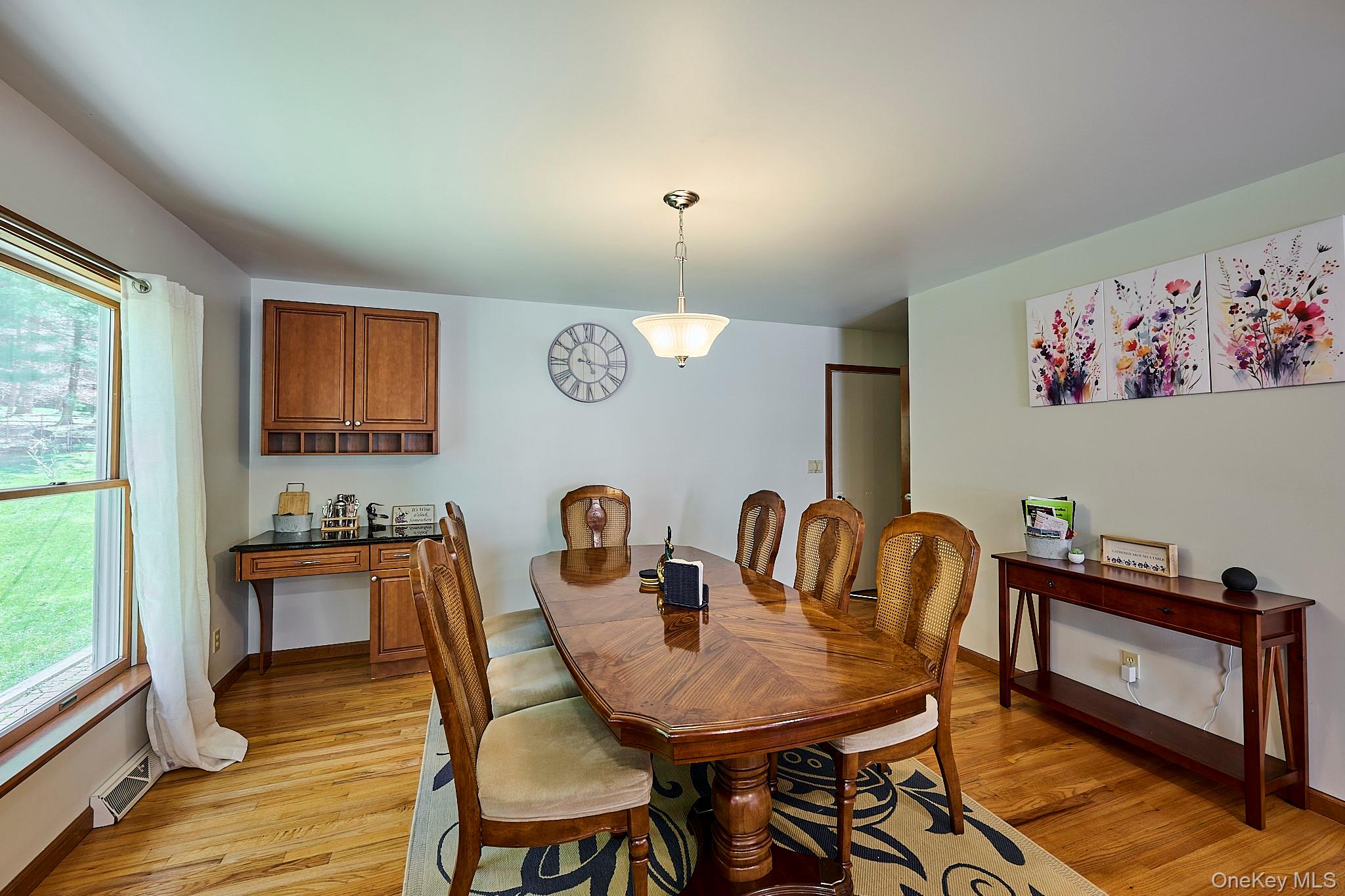 39 Pitio Road Glen Spey, NY 12737 - Photo 27 of 50 a view of a dining room with furniture a chandelier and wooden floor