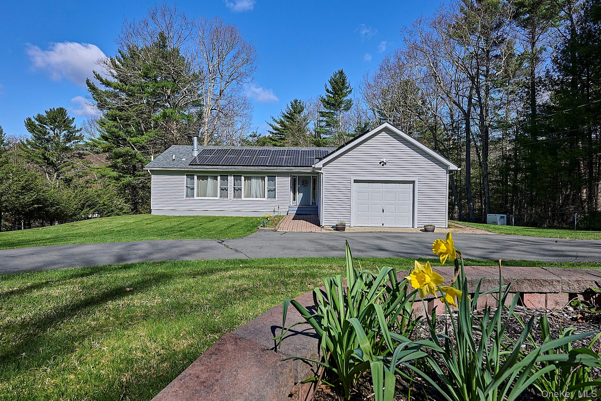 39 Pitio Road Glen Spey, NY 12737 - Photo 3 of 50 a front view of a house with a garden and yard