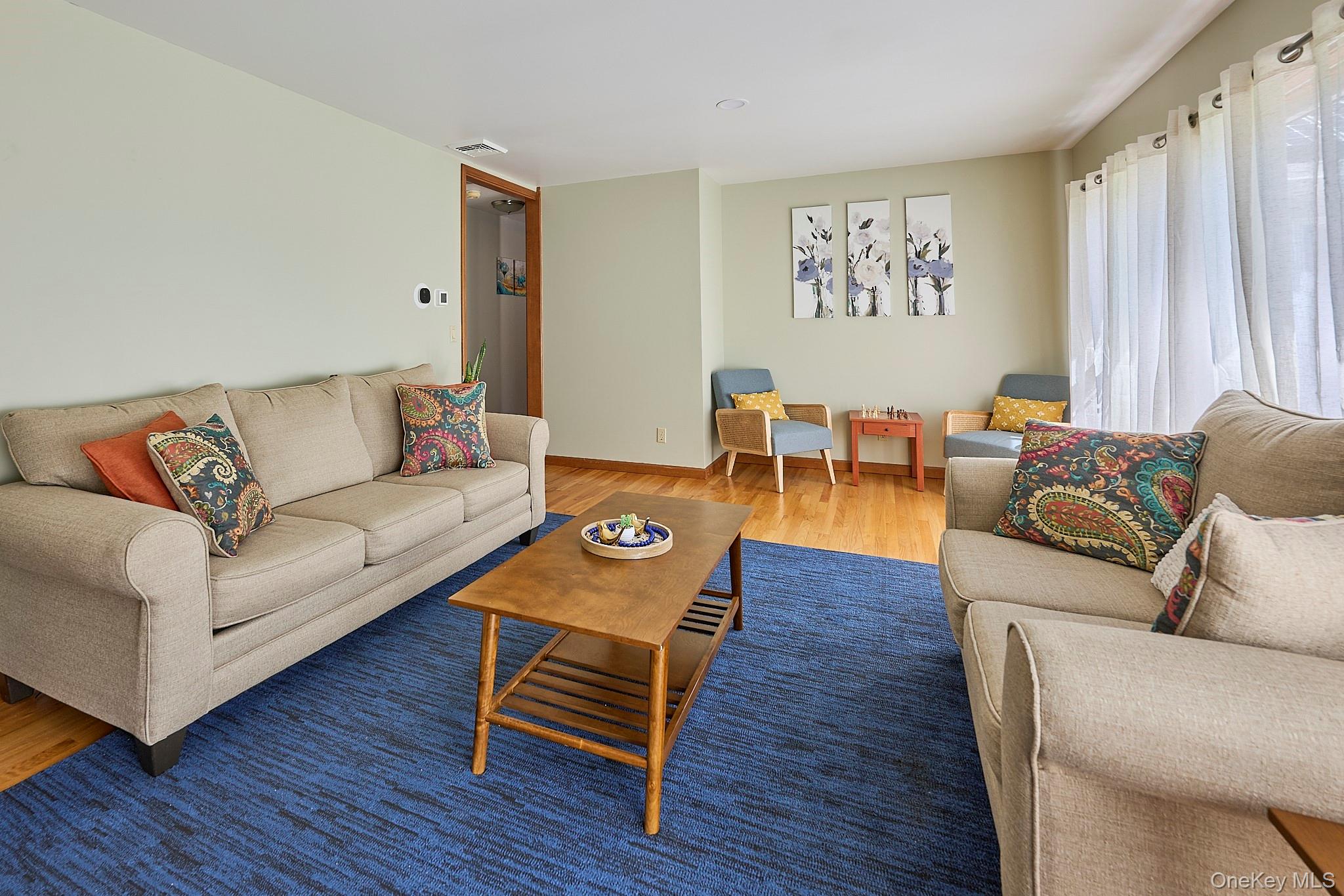 39 Pitio Road Glen Spey, NY 12737 - Photo 32 of 50 a living room with furniture and wooden floor