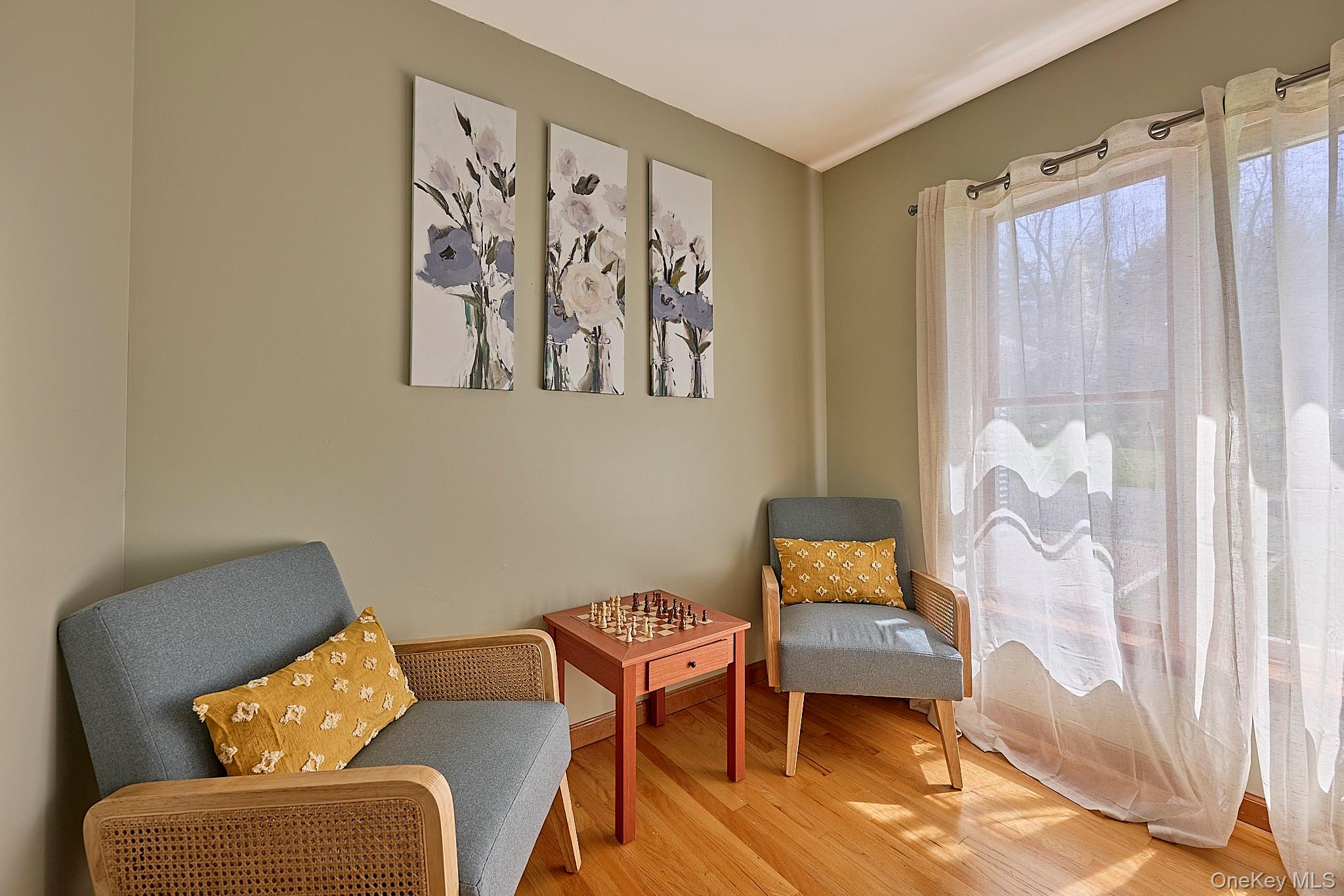 39 Pitio Road Glen Spey, NY 12737 - Photo 33 of 50 a blue chair sitting in a room next to a window