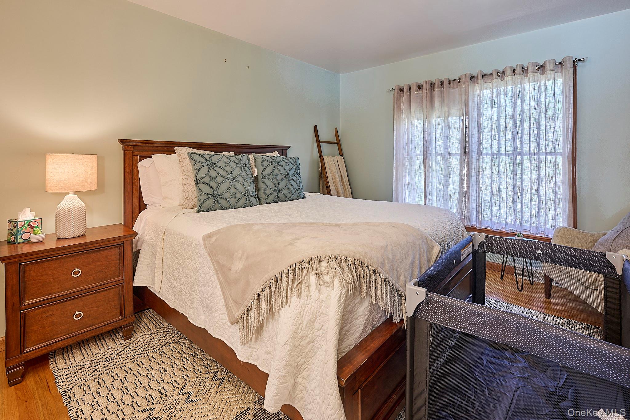 39 Pitio Road Glen Spey, NY 12737 - Photo 34 of 50 a bedroom with a bed and a window