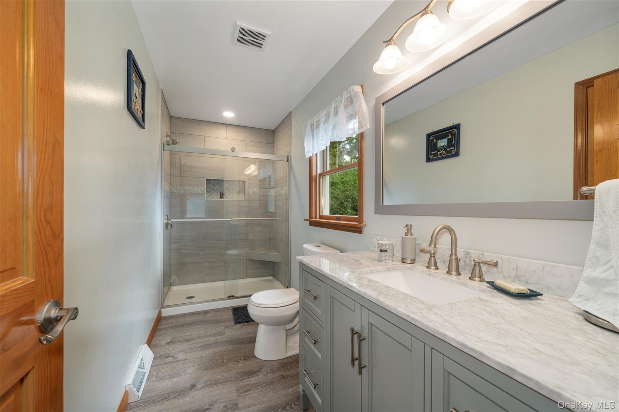39 Pitio Road Glen Spey, NY 12737 - Photo 35 of 50 a bathroom with a granite countertop sink a toilet and shower