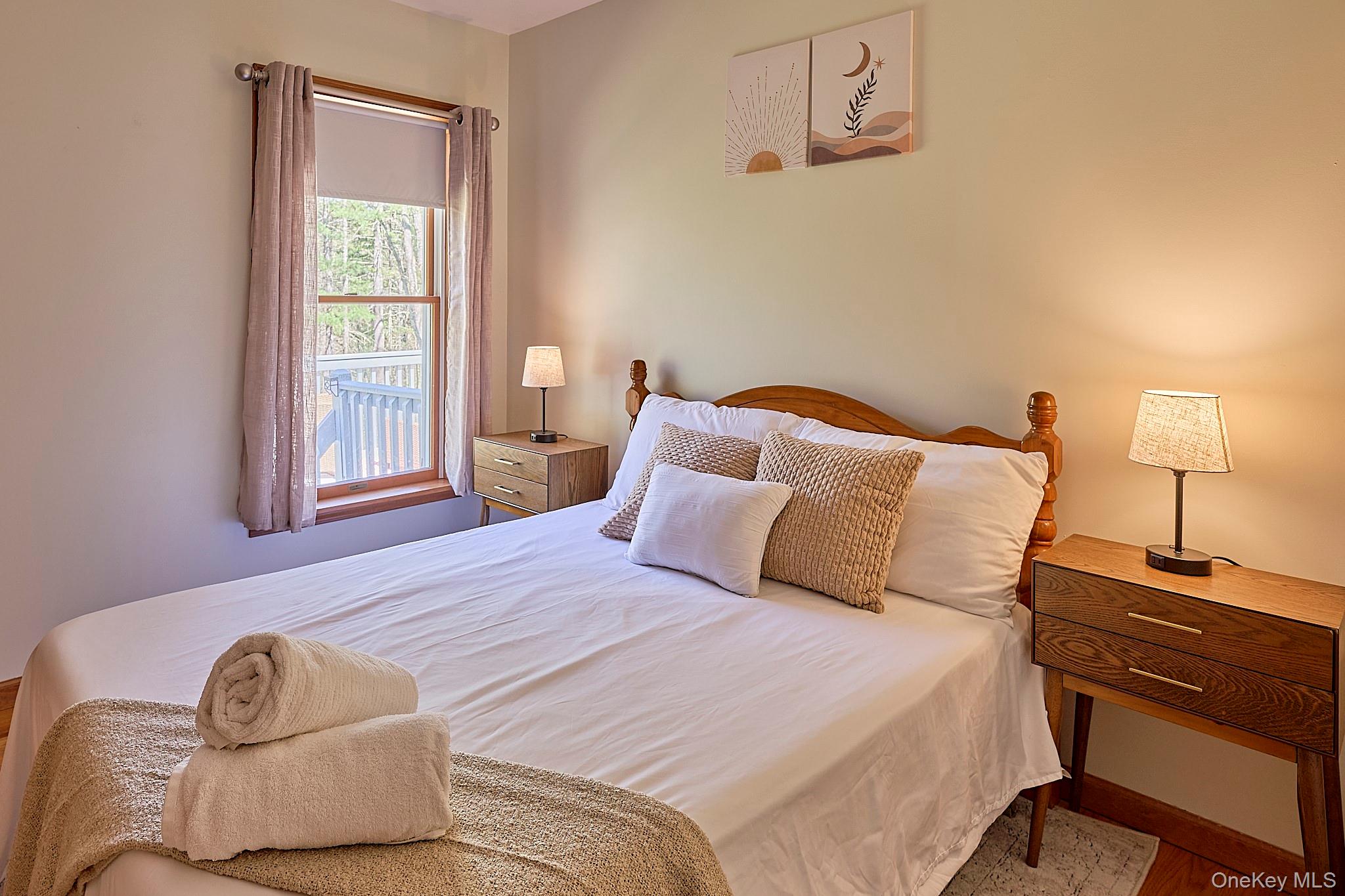 39 Pitio Road Glen Spey, NY 12737 - Photo 36 of 50 a bedroom with a bed and a window