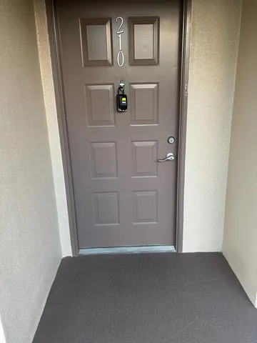 a view of hallway with wooden floor