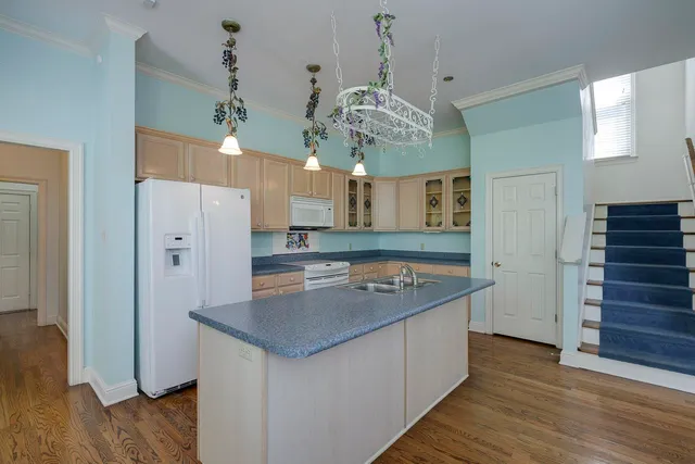 a view of a kitchen counter space a sink and dishwasher