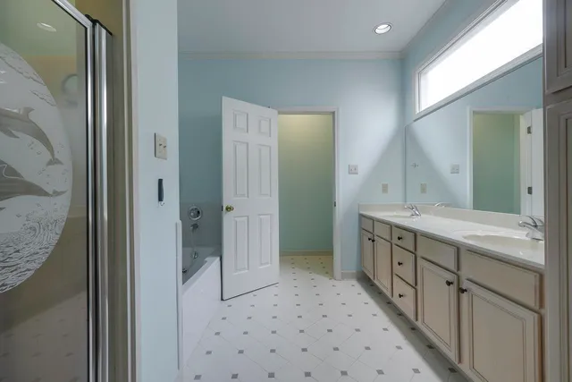 a bathroom with a double vanity sink and mirror