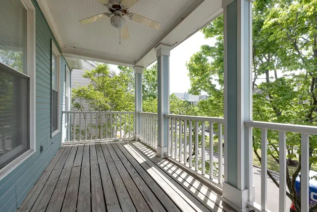a view of balcony with wooden floor