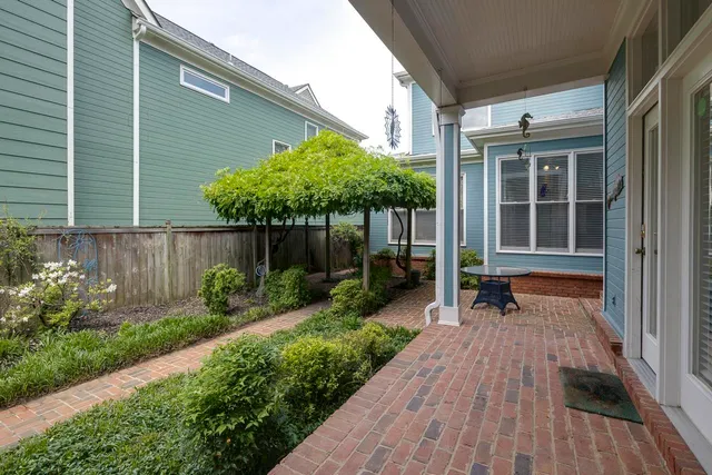 a view of house with backyard and garden