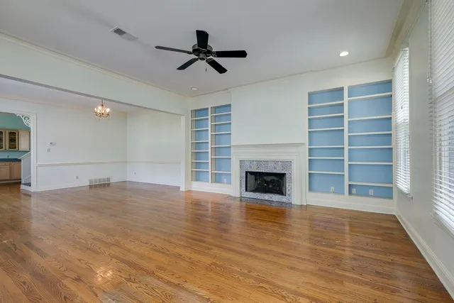 a view of a livingroom with a fireplace and window