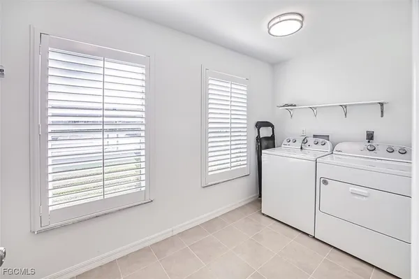 a room with a window and a dresser