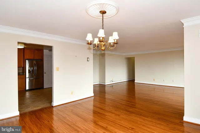 a kitchen with stainless steel appliances a stove microwave and refrigerator