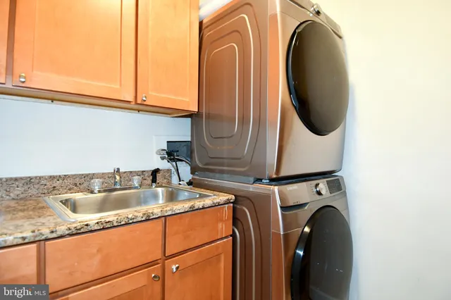 a view of an empty room and wooden floor