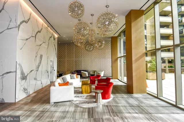 a view of a patio with table and chairs and potted plants