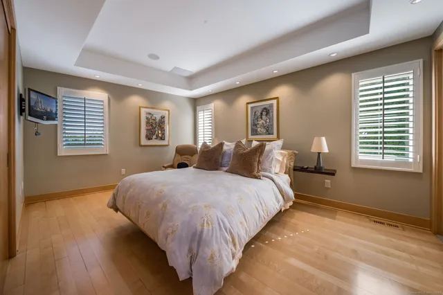 a bed room with a bed and a window