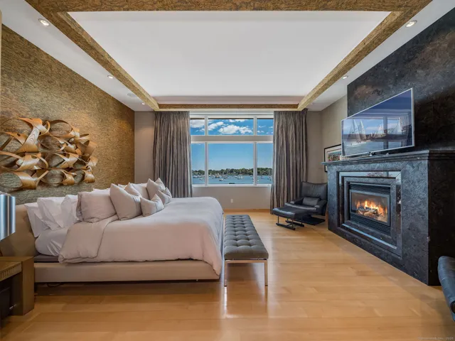 a bedroom with a bed and a fireplace