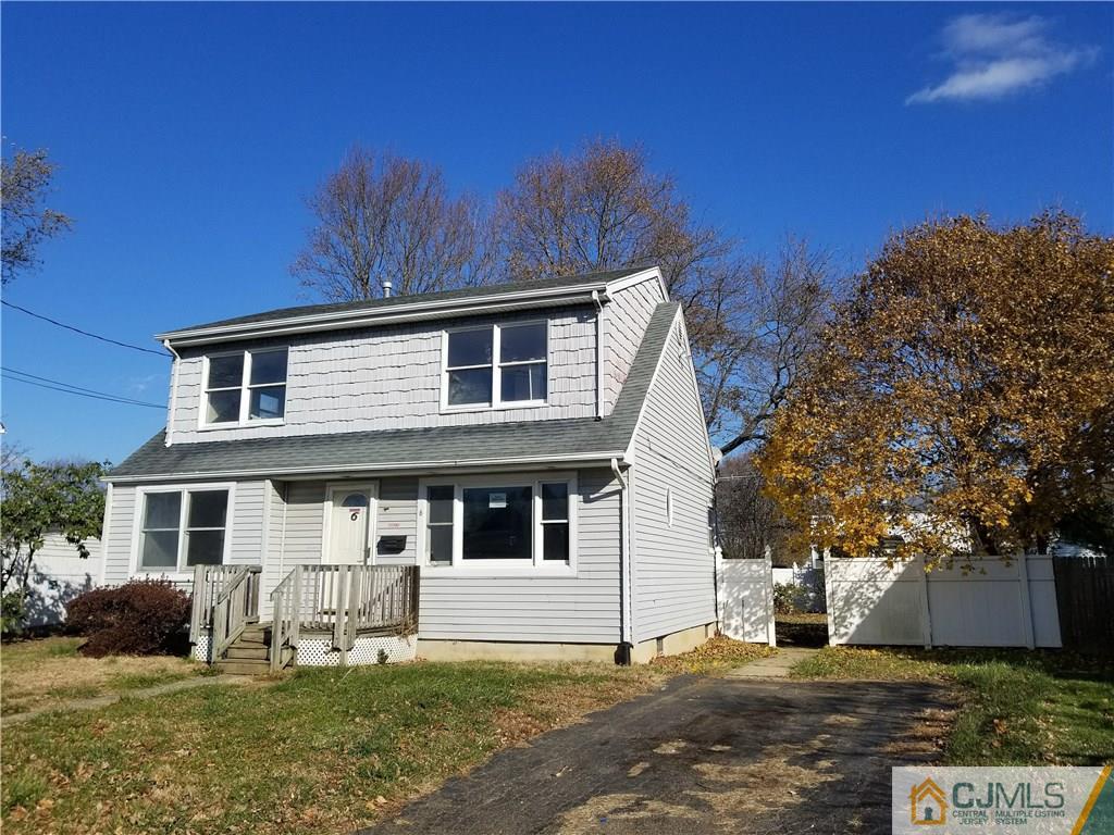 6 Rodney Road East Brunswick, NJ 08816 - Photo 1 of 15 a front view of a house with a yard