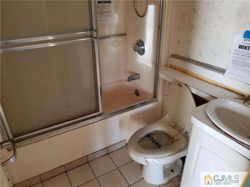 6 Rodney Road East Brunswick, NJ 08816 - Photo 6 of 15 a bathroom with a toilet and a shower