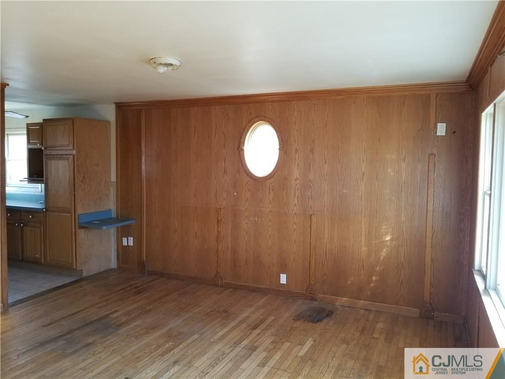 6 Rodney Road East Brunswick, NJ 08816 - Photo 7 of 15 a view of a room with wooden floor and window