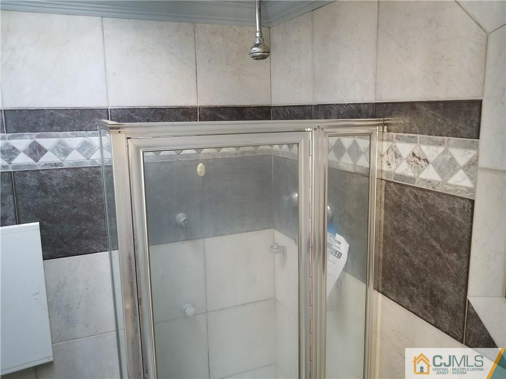 6 Rodney Road East Brunswick, NJ 08816 - Photo 10 of 15 a close view of a sink and cabinets