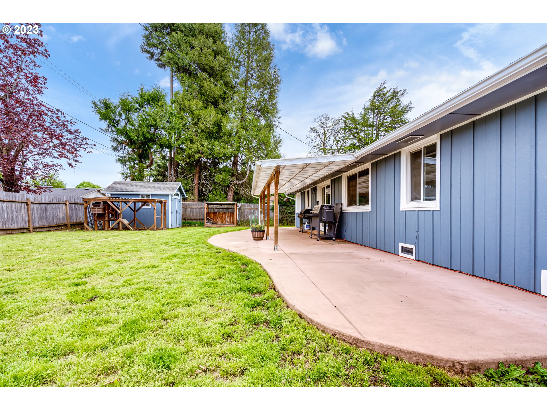 833 Elm Drive Eugene, OR 97404 - Photo 18 of 20 a front view of a house with a yard