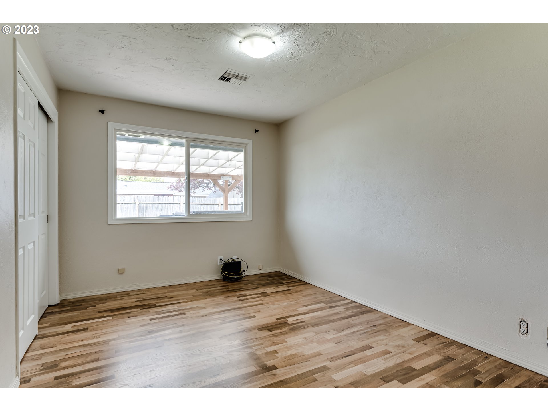 833 Elm Drive Eugene, OR 97404 - Photo 10 of 20 a view of an empty room and window