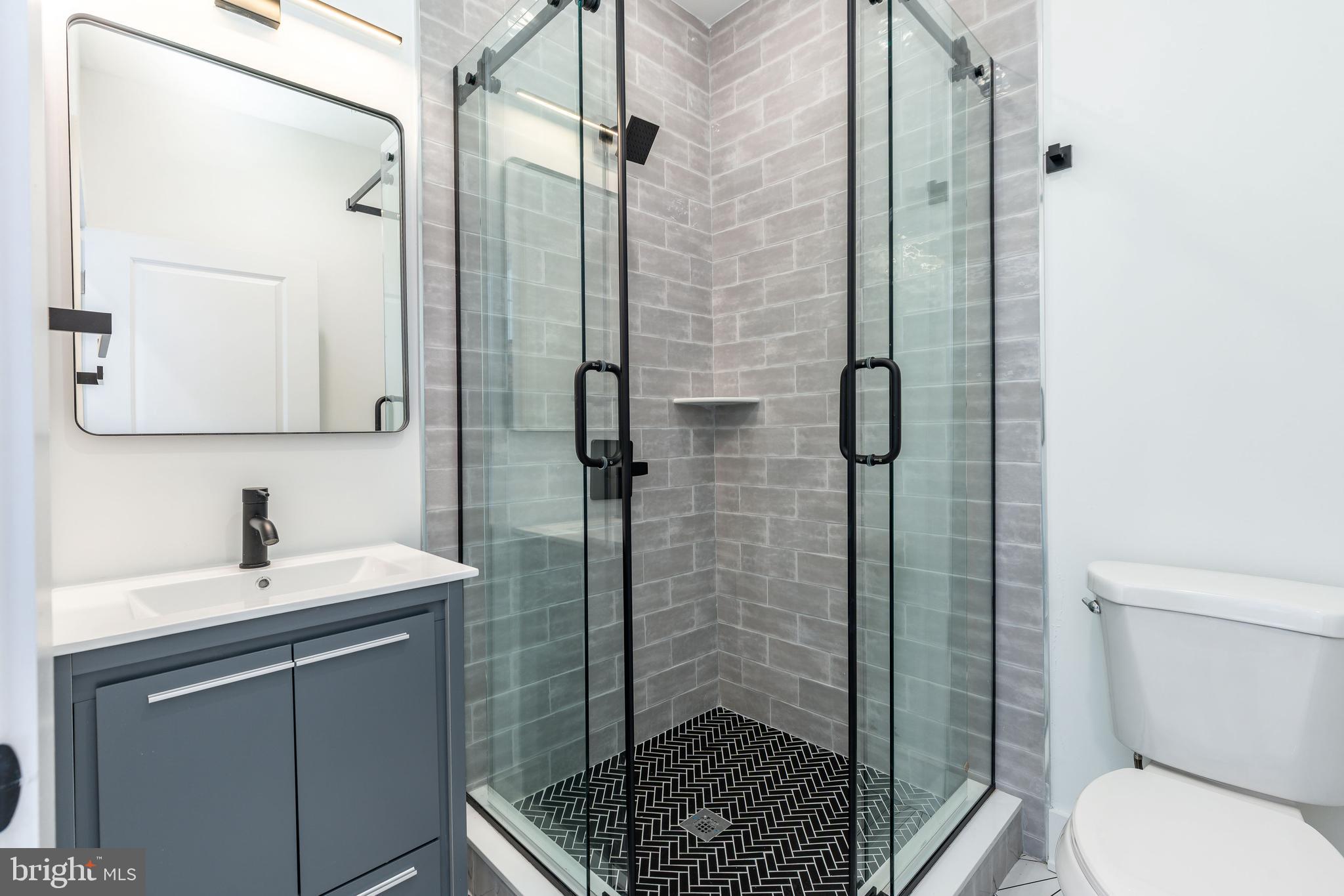 2252 North Front Street, Unit 3 Philadelphia, PA 19133 - Photo 12 of 20 a bathroom with a sink toilet and shower
