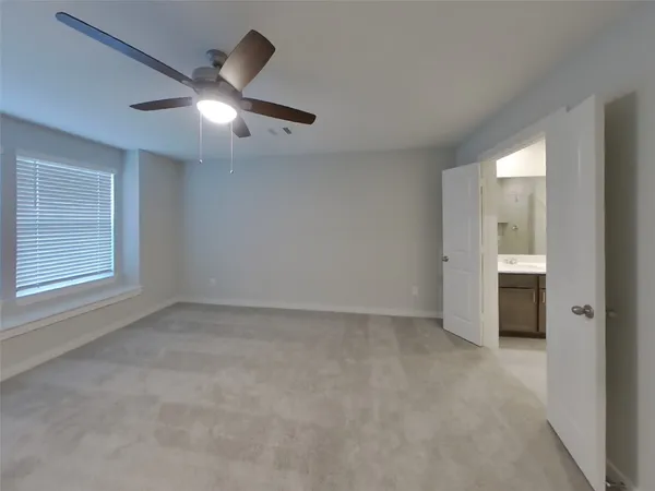 an empty room with a bathroom