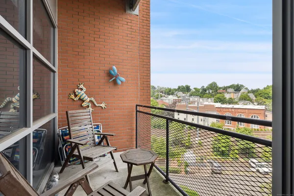 a view of a balcony with chairs