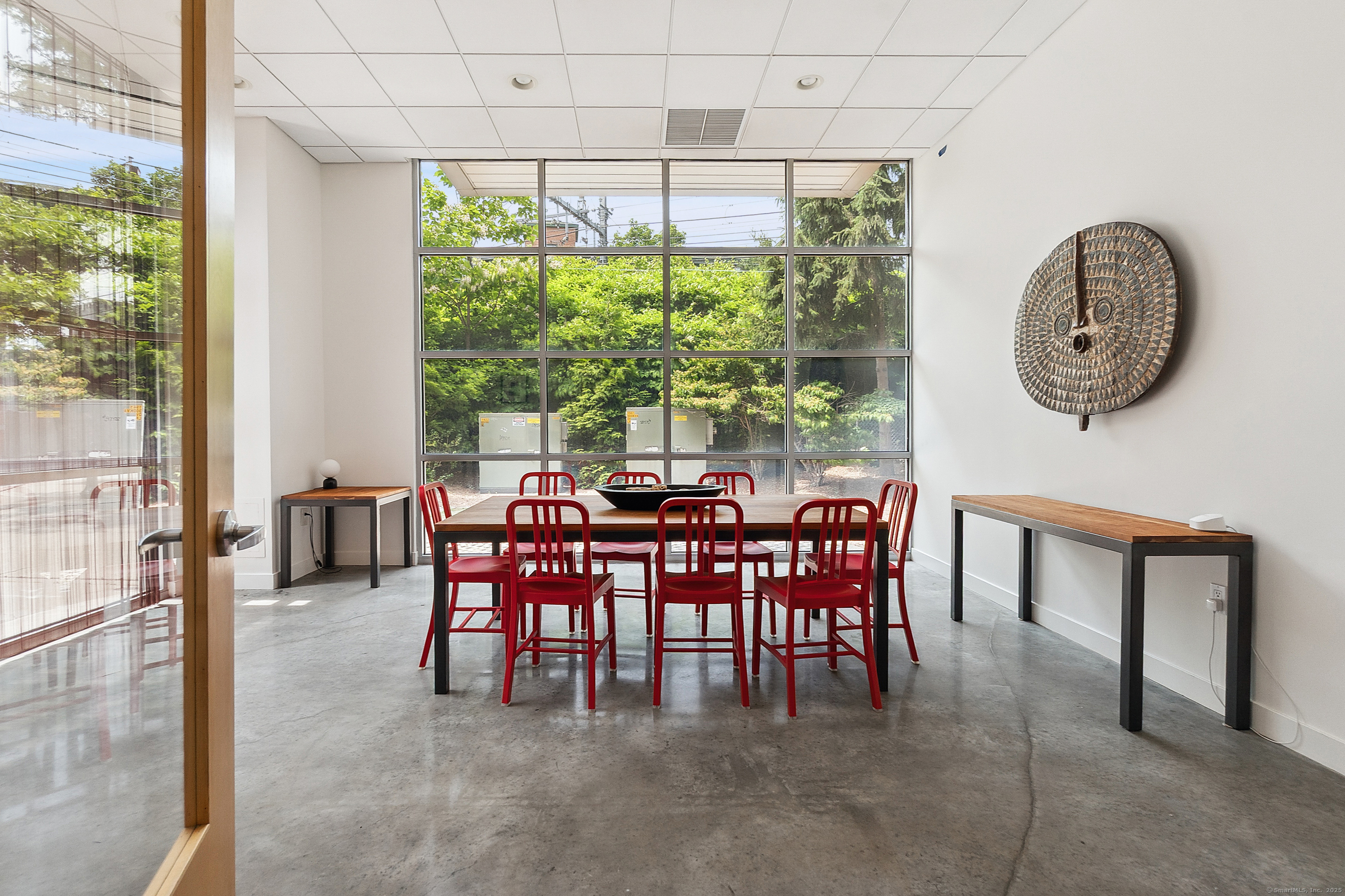 33 North Water Street, Unit 505 Norwalk, CT 06854 - Photo 17 of 25 a dining room with furniture and a large window