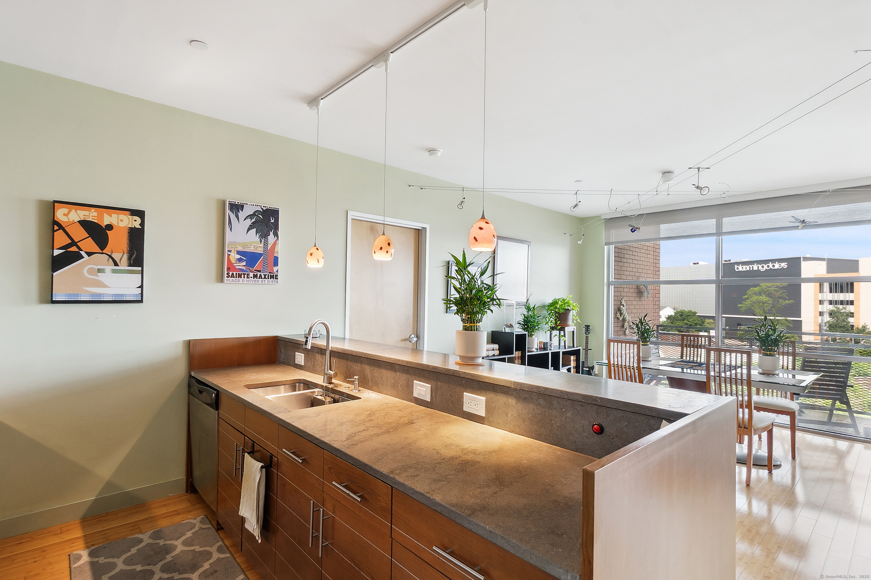 33 North Water Street, Unit 505 Norwalk, CT 06854 - Photo 4 of 25 a kitchen with stainless steel appliances a sink and a large window