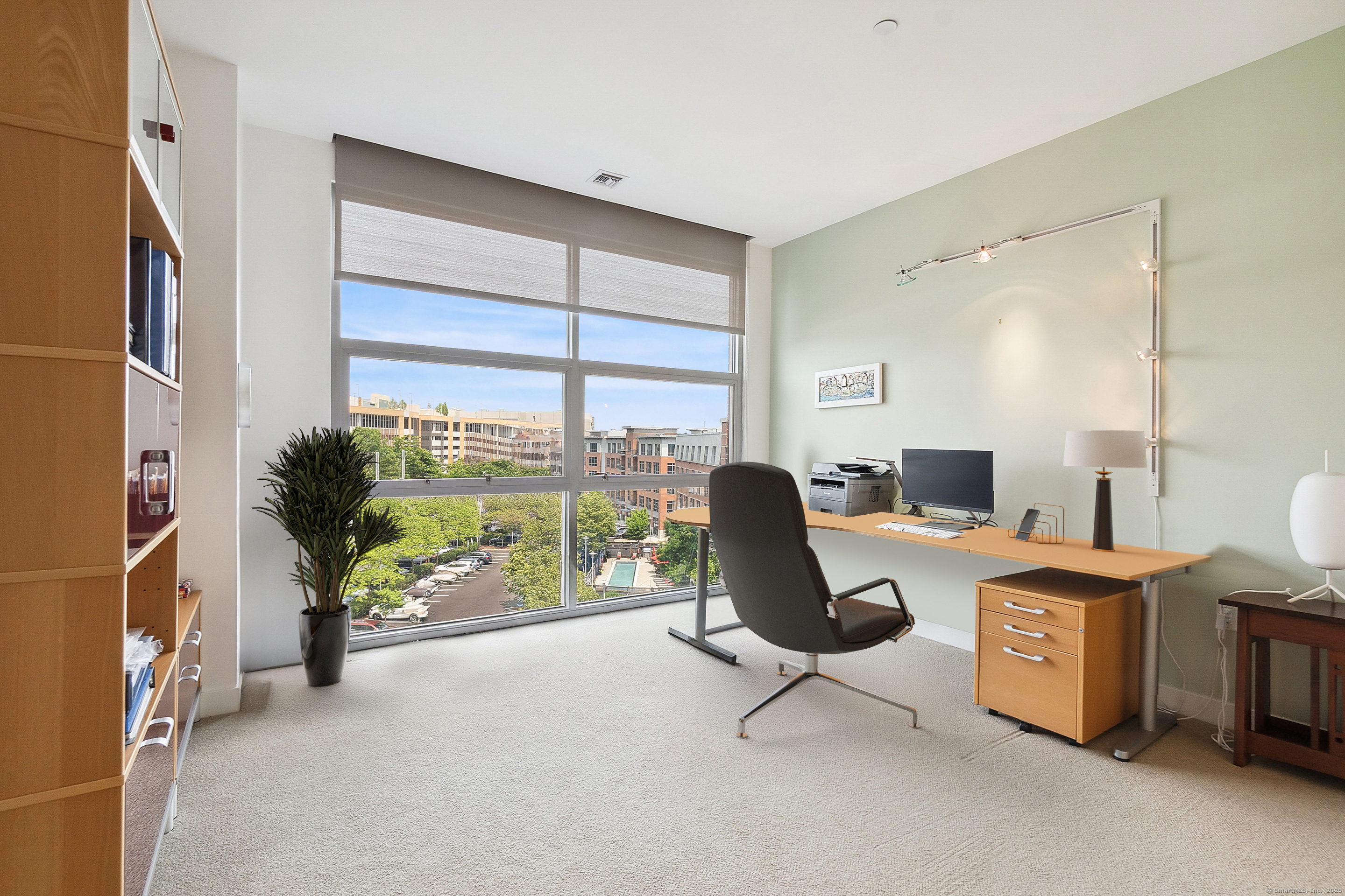 33 North Water Street, Unit 505 Norwalk, CT 06854 - Photo 9 of 25 a view of a workspace with furniture and a window