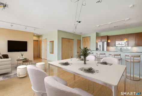 a view of a dining room with furniture and wooden floor