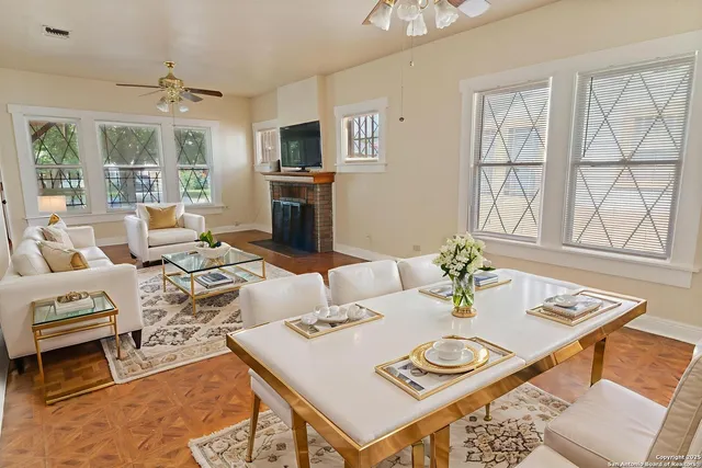 a living room with furniture and a table
