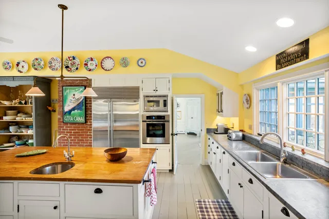 a kitchen with stainless steel appliances granite countertop a sink and counter space