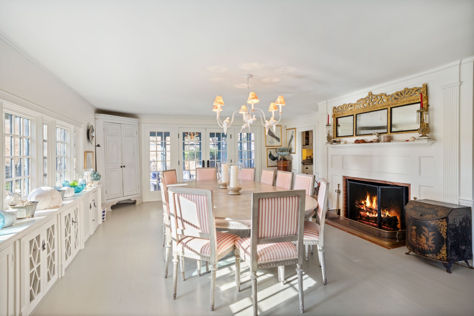 85 North Reservoir Road Vineyard Haven, MA 02568 - Photo 16 of 42 a dining room with furniture and a fireplace