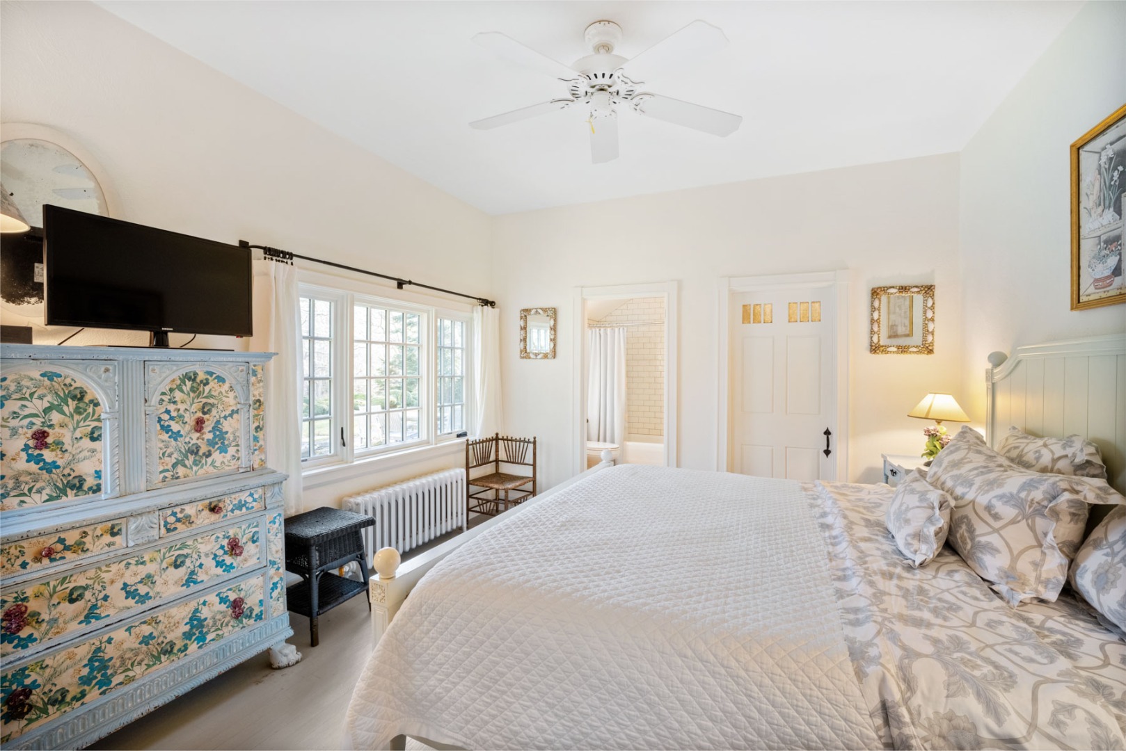 85 North Reservoir Road Vineyard Haven, MA 02568 - Photo 30 of 42 a bedroom with a bed a flat screen tv and a window