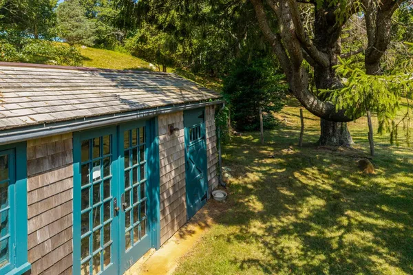 a view of a house with a tree