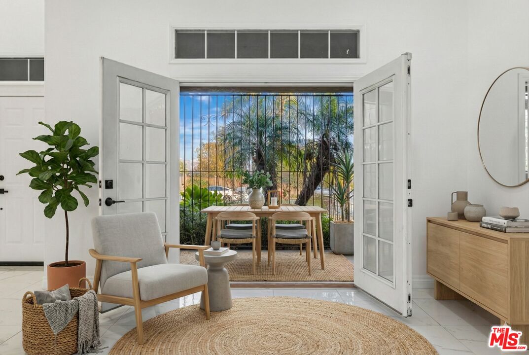6758 Ridgeline Avenue San Bernardino, CA 92407 - Photo 12 of 67 a living room with furniture a potted plant and a large window