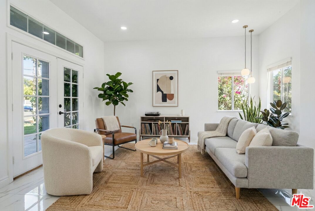 6758 Ridgeline Avenue San Bernardino, CA 92407 - Photo 14 of 67 a living room with furniture potted plant and a large window