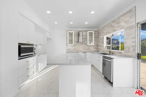 a bathroom with a sink a mirror and a shower