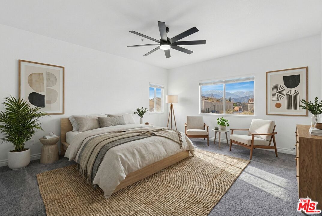 6758 Ridgeline Avenue San Bernardino, CA 92407 - Photo 20 of 67 a bedroom with a large bed and a couch