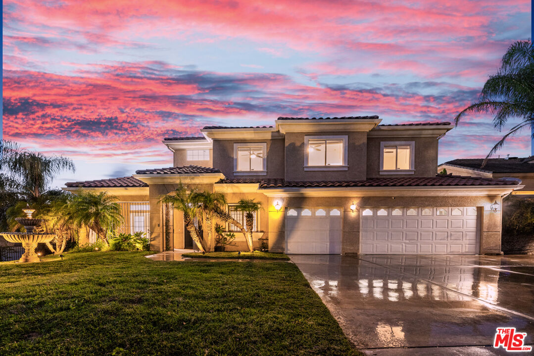6758 Ridgeline Avenue San Bernardino, CA 92407 - Photo 2 of 67 a front view of a house with a yard