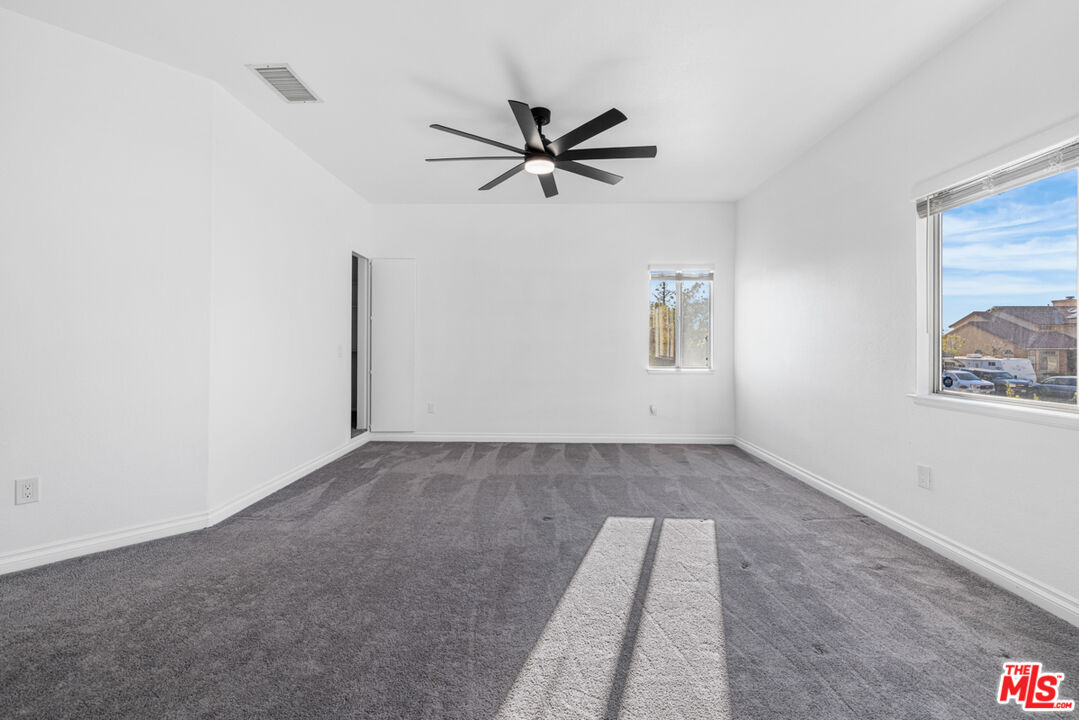 6758 Ridgeline Avenue San Bernardino, CA 92407 - Photo 23 of 67 a view of a room with window and ceiling fan