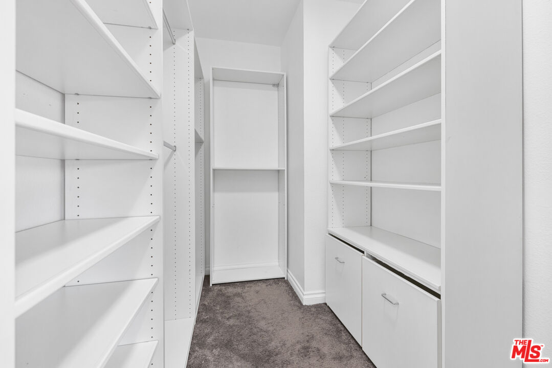 6758 Ridgeline Avenue San Bernardino, CA 92407 - Photo 27 of 67 a view of walk in closet with empty racks