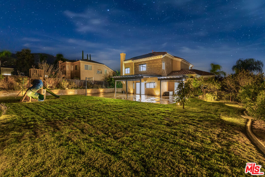 6758 Ridgeline Avenue San Bernardino, CA 92407 - Photo 3 of 67 a view of a big yard next to a building