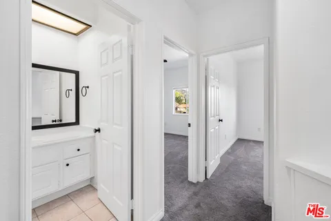 a view of a patio with table and chairs potted plants with wooden fence