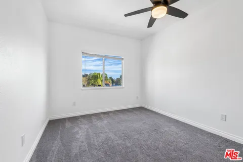 a view of a park with swings and slides