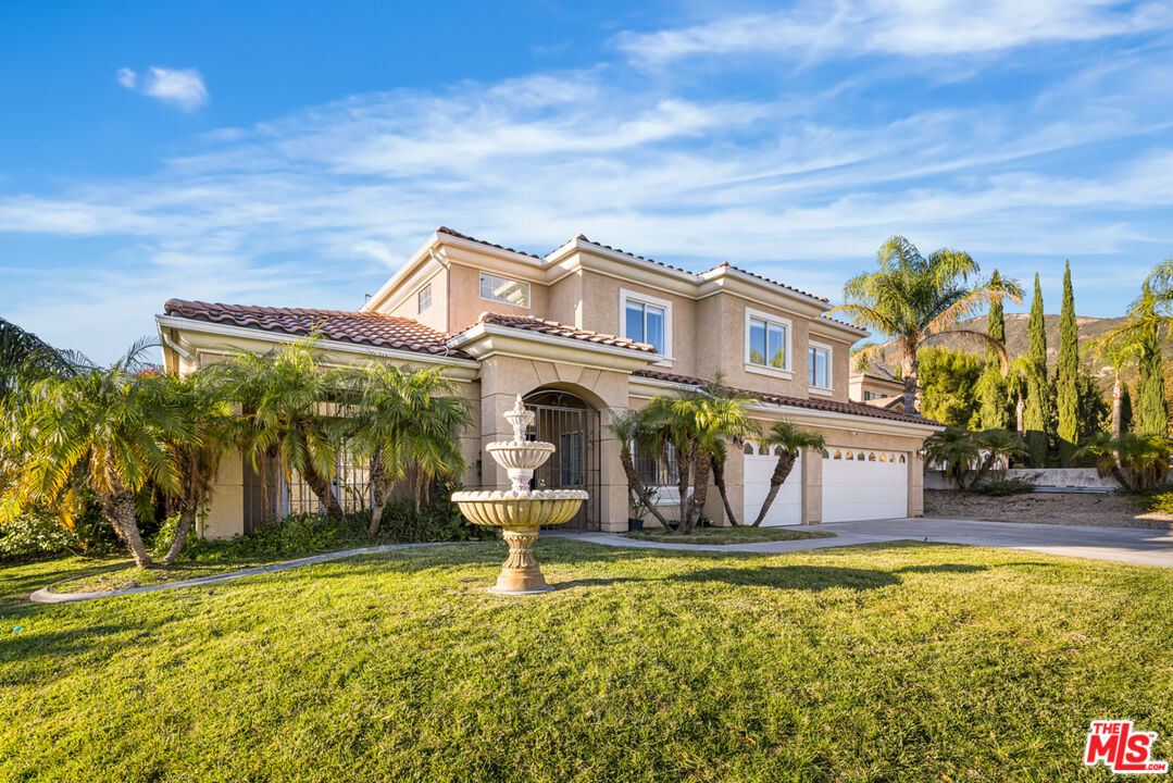 6758 Ridgeline Avenue San Bernardino, CA 92407 - Photo 61 of 67 a front view of a house with garden