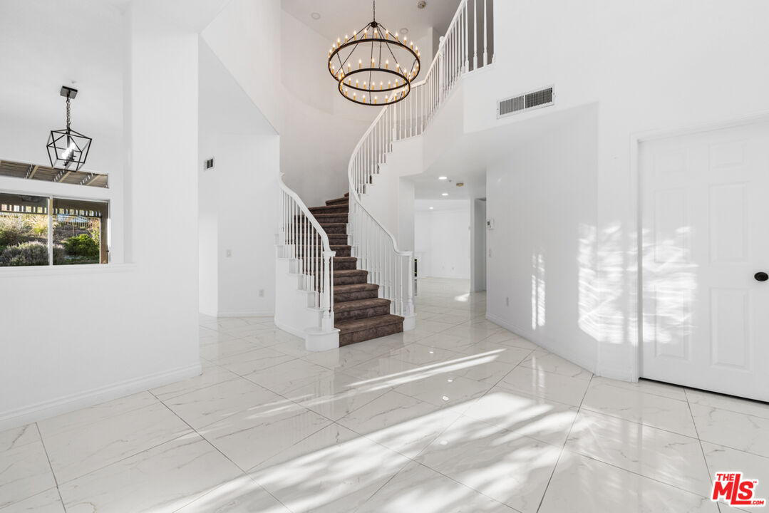 6758 Ridgeline Avenue San Bernardino, CA 92407 - Photo 8 of 67 a view of entryway with wooden floor