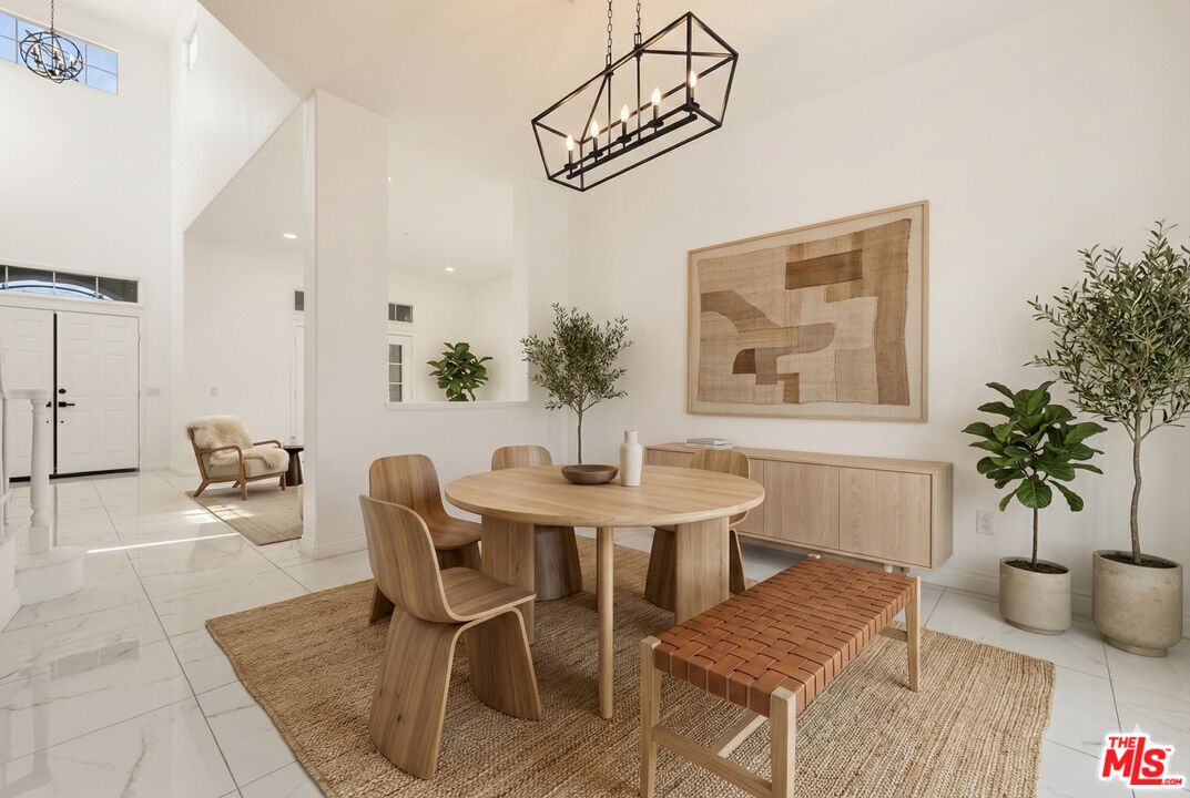 6758 Ridgeline Avenue San Bernardino, CA 92407 - Photo 9 of 67 a view of a dining room with furniture and wooden floor